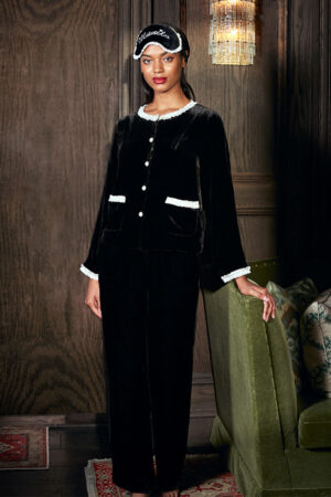 Luxurious MANITO Charlotte black velvet women's lounge set with white trim detailing.