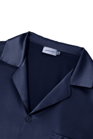 Close-up of MANITO Chemise Mashinen navy silk pajama collar, showing smooth lapel construction and subtle brand label.