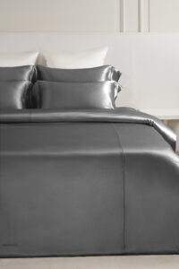 MANITO Classic Soft Light Bedding Set in gray, styled with contrasting furniture for a contemporary look.