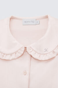 Close-up of the collar and button details on the pink Cloud Silk Nightgown for girls.