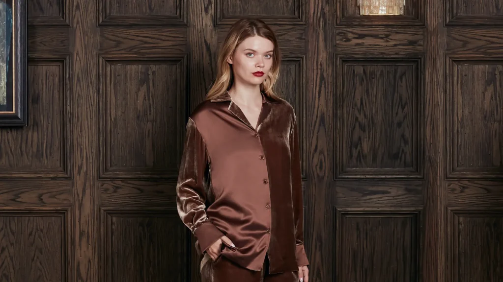 Woman in a silk-velvet lounge set, mixing silk with other fabric textures.