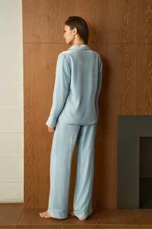 Back view of woman in blue Combo Velvet Pajama Set, showing the easy drape and straight, comfortable pant legs.