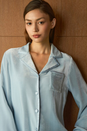 Close-up of woman in blue Combo Velvet Pajama Set, highlighting the velvet texture, satin sheen and relaxed collar.