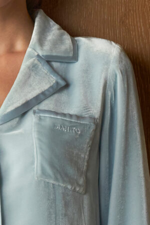 Detail of blue Combo Velvet Pajama Set top, focusing on the velvet chest pocket with subtle MANITO logo and satin-wrapped collar.