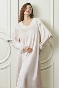 Woman wears pink Court Women's Nightdress in pink, showing double-layer lace V-neck and puff sleeves for a dreamy feel.
