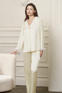 Model wears Court Women's Pajama Set with relaxed posture, highlighting the flowing drape and romantic lace details.
