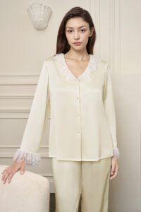 Model in Court Women's Pajama Set, showing delicate lace accents and pearl buttons elevate everyday elegance.