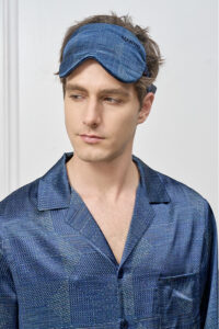 Model wears Cube Men's Eye Mask in a side gaze, highlighting the contoured design and MANITO embroidered logo.