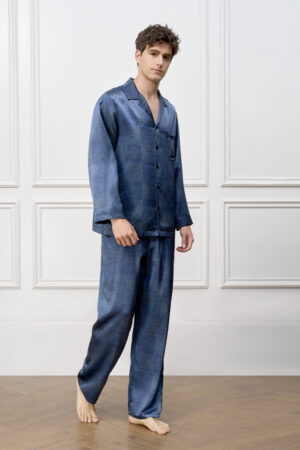 Model wears navy MANITO Cube Men's Pajama Set, standing barefoot in a calm pose, creating a refined lounge mood.