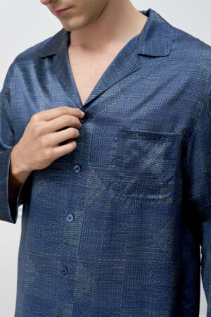 Detail of MANITO Cube Men's Pajama Set embroidery and buttons, showcasing refined design.