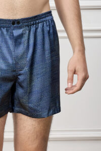 Close-up of Cube Men's Shorts waistband with double-button front, emphasizing comfort and refined pattern design.