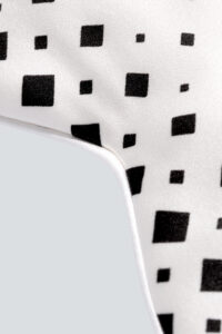 Extreme close-up highlighting the unique pattern of MANITO Cubes Silk Eye Mask, emphasizing the texture of the fabric.