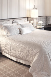 Damier Silk Duvet Cover with abstract chessboard pattern, adding artistic touch to the bedroom.