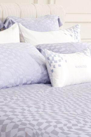 Damier Silk Bedding Set in purple, featuring a chessboard-inspired pattern for a sophisticated bedroom look.