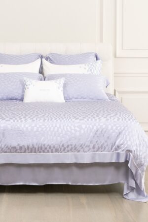 Damier Silk Bedding Set in purple, featuring white and lavender pillows.