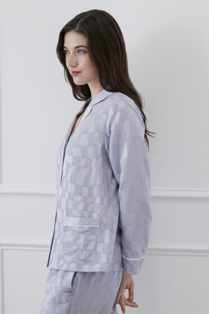 Side view of MANITO Damier Women's Pajama Set highlighting jacquard silk texture and piping details.
