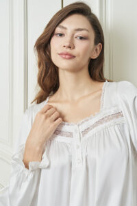 Close-up of Dream Women's Nightdress in white silk, highlighting the lace-trimmed neckline and soft satin glow.