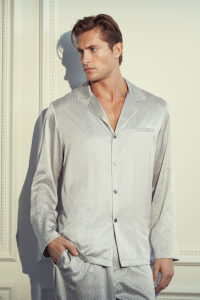 Man in a Classic Monogram Men's Silk Pajama Set exuding timeless style and comfort.