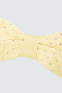Close-up of a yellow Duchess Pink Bow Silk Cute Eye Mask with diamonds embellishments.