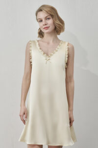 MANITO Duchess Silk Ruffle Dress in light yellow with V-neck and ruffled lace trim.
