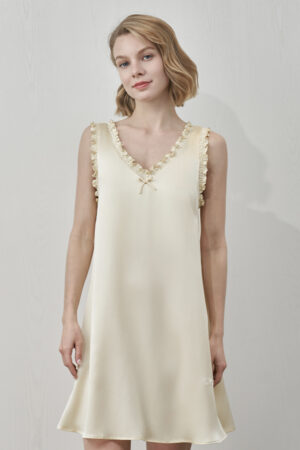 MANITO Duchess Silk Ruffle Dress in light yellow with V-neck and ruffled lace trim.