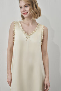 MANITO Duchess Silk Ruffle Dress side view showing ruffle-trimmed V-neckline in light yellow.