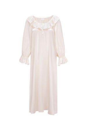 Flat lay of MANITO Echoes Silk Ruffle Dress in pink, showcasing the ruffled neckline, and buttoned front detail.