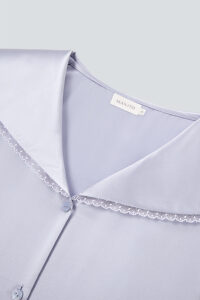 Close-up of the neckline with white lace trim from MANITO Effie Women's Pajama Set.