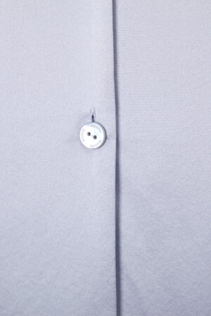 Close-up of the button on MANITO Effie Women's Pajama Set, showcasing the elegant design of this white lace pajama set.