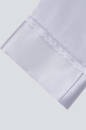 Close-up of the sleeve with white lace detail from the MANITO Effie Women's Pajama Set.