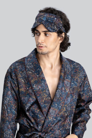 Man wearing Euphoria Silk Eye Mask paired with a matching floral silk robe.