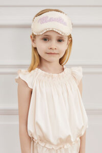 Child models Fairy Kid's Eye Mask with soft silk fabric and fairy-tale inspired style.