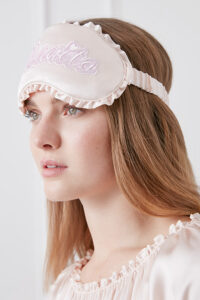 Side view of model wearing MANITO Fairy Silk Eye Mask, highlighting smooth silk finish and delicate trim.