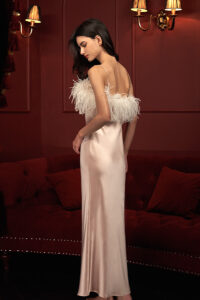Fiesta pink feather silk nightdress with a woman wearing it, showcasing the back design.