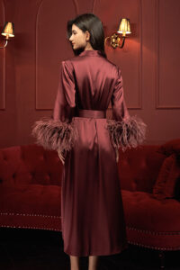 Back view of red charmeuse silk long robe showcasing a refined belt and feather accents, ideal for festive wear.