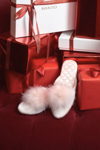 MANITO Silk Women's red slipper on a luxurious background with gifts, embodying festive elegance.