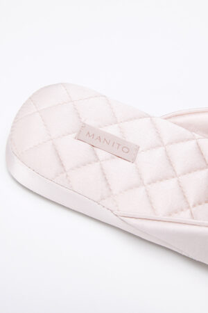 Close-up of MANITO Silk Women's pink slipper's textured sole, showcasing detailed craftsmanship.