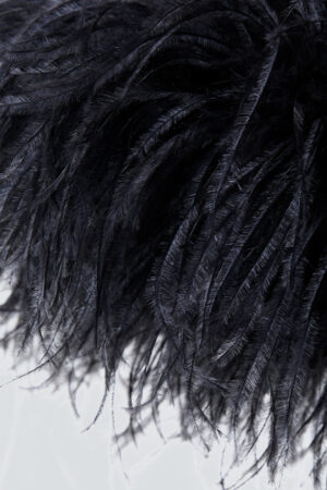 Detailed feather design on the cuff of Fiesta velvet holiday pajama set in black.