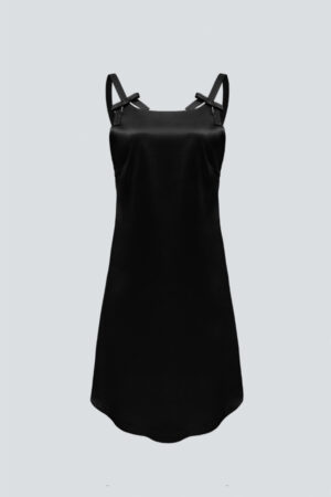 A close-up of the straps of black Glitter short dress with bow details and sparkling rhinestones.