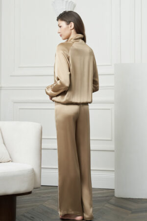 Back view of woman in Gloaming Women's Pajama Set, displaying the smooth drape of the stretch silk jacket and pants.