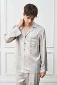 Model in Greywake Men's Pajama Set with relaxed pose, conveying classic British elegance and casual comfort.