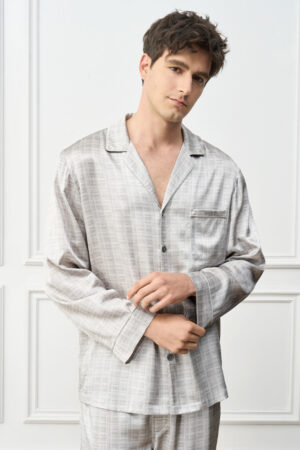 Model in Greywake Men's Pajama Set gently adjusts the cuff, emphasizing ergonomic comfort and refined tailoring.