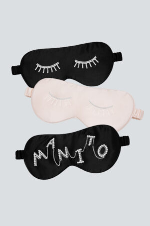 Pearlwear Silk Eye Mask collection in black and pink, blending pearl luster and crystal detailing for refined nighttime elegance.