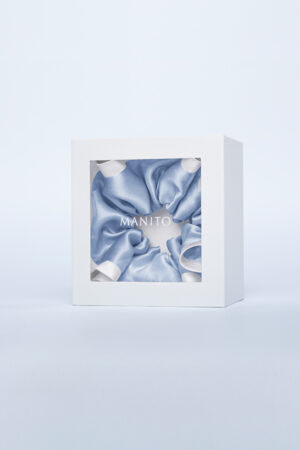 Two-tone Silk Scrunchie in classic peony white creates a sweet vintage look, beautifully displayed in a gift box at the center.