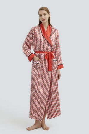 Model standing in Infinite Women's Long Silky Robe with geometric pattern and contrasting red collar.