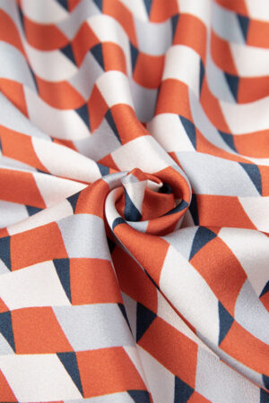 Close-up of the geometric fabric pattern of the Infinite Women's Long Silky Robe.