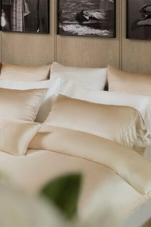 Beautifully layered MANITO silk bedding set in a stylish bedroom, featuring Infinity Mulberry Silk Duvet Cover.