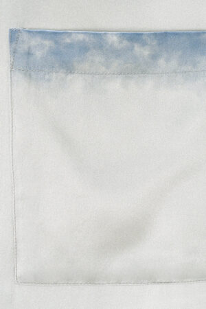 Close-up of the pocket design on MANITO Inkmark Men's Short Pajama Set with soft blue gradient trim.