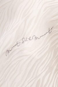 Close-up of MANITO Jungle Tiger Print Pajama Set fabric showing subtle tiger-inspired jacquard and silk detail.