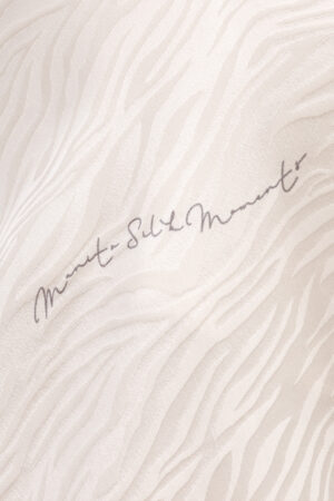 Close-up of MANITO Jungle Tiger Print Pajama Set fabric showing subtle tiger-inspired jacquard and silk detail.